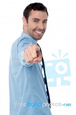 Young Handsome Businessman Pointing At You Stock Photo