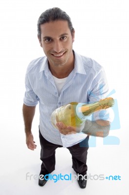 Young Handsome Guy Holding Wine Bottle Stock Photo