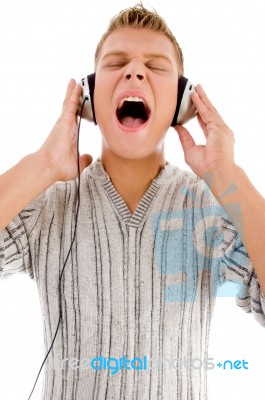 Young Handsome Man Enjoying Music With Headphones Stock Photo