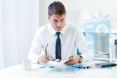 Young Handsome Man Working In His Office Stock Photo