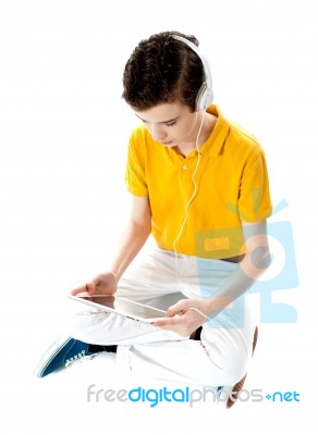 Young Kid Lost In His Own Music World Stock Photo