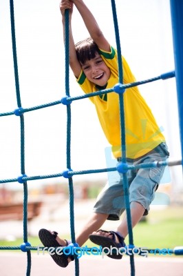 Young Kid On Playstructure Stock Photo