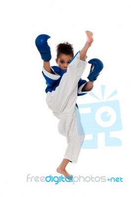 Young Kid Practicing Karate Stock Photo