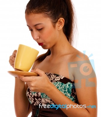 Young Lady Cooling Her Coffee Stock Photo