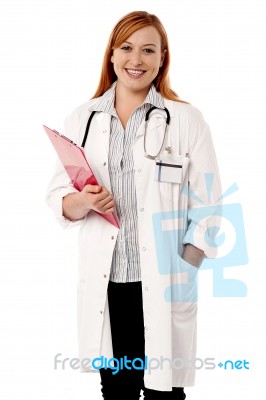 Young Lady Doctor Holding Clipboard Stock Photo