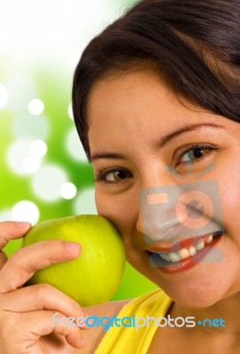 Young Lady Holding An Apple Stock Photo