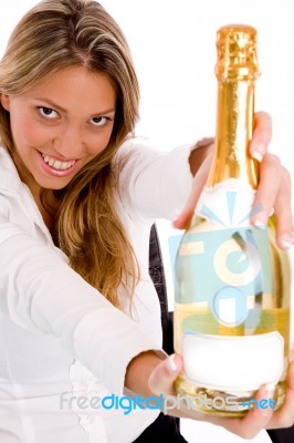 Young Lady Holding Champagne Bottle Stock Photo