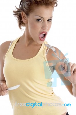 Young Lady Holding Fork And Knife Stock Photo