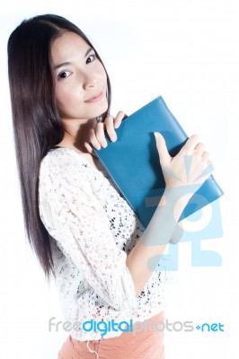 Young Lady Holding Notebook Stock Photo