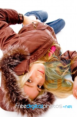 Young lady lying on floor Stock Photo