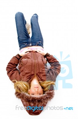 Young lady lying on floor Stock Photo