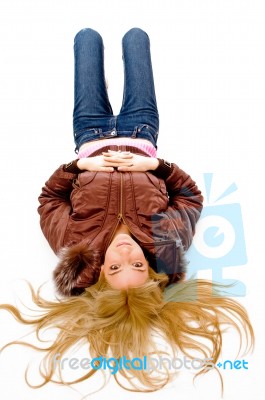 Young lady lying on floor Stock Photo