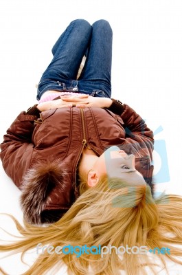 Young lady lying on floor Stock Photo