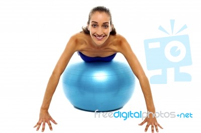 Young Lady Performing Abdomen Exercise Stock Photo