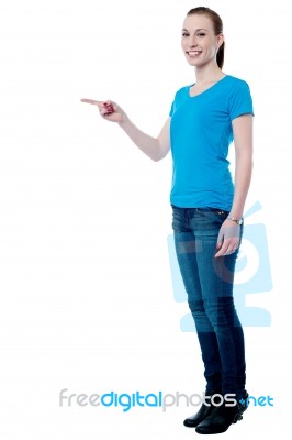 Young Lady Pointing Away Stock Photo