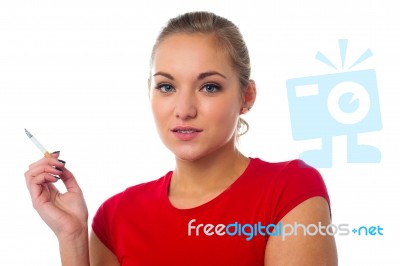 Young Lady Posing With Cigarette Stock Photo