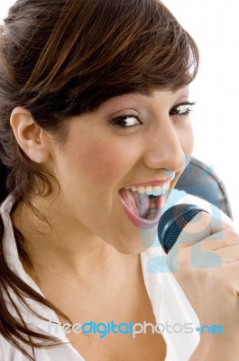 young lady singing with Mic Stock Photo