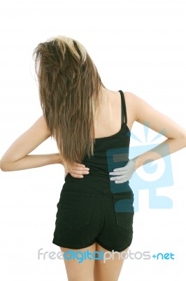 Young Lady Suffering From Back Pain Stock Photo