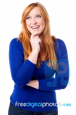 Young Laughing Woman Imagining Something Stock Photo