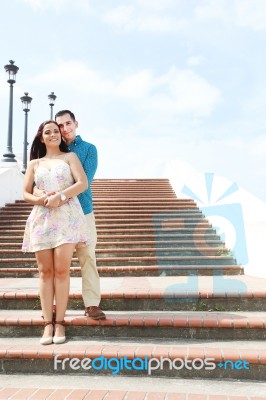 Young Lovers Hugging On Stairs Stock Photo