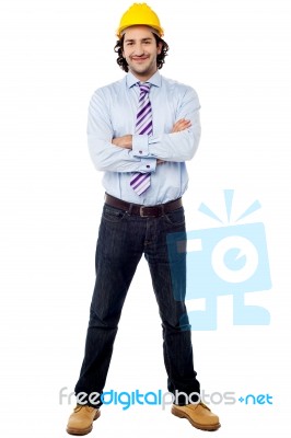 Young Male Architect With Arms Crossed Stock Photo