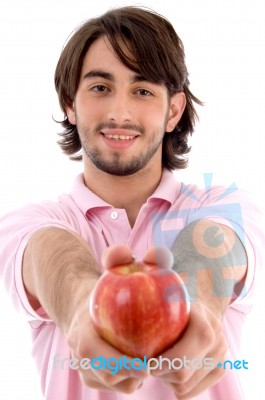 Young Male Holding Apple Stock Photo