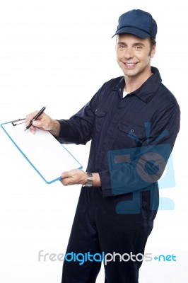 Young Male Holding Clipboard Stock Photo