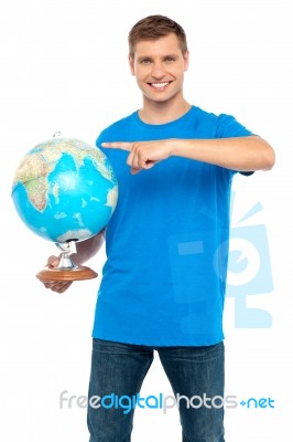 Young Male Holding Globe Stock Photo