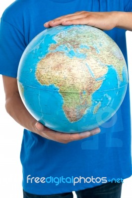 Young Male Holding Globe Stock Photo