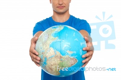 Young Male Holding Globe Stock Photo