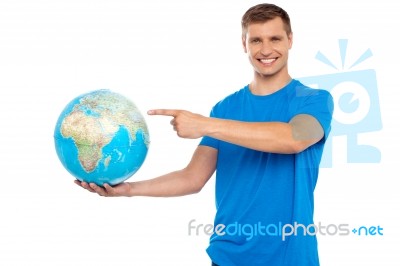 Young Male Holding Globe Stock Photo