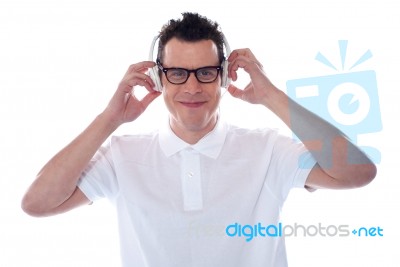 Young Male Holding Headphone Stock Photo