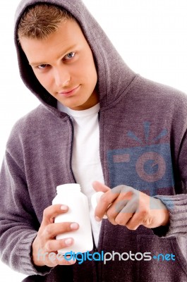 Young Male Holding Medicine Bottle Stock Photo