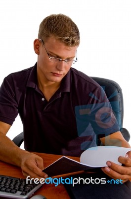 Young Male Looking In To Book Stock Photo