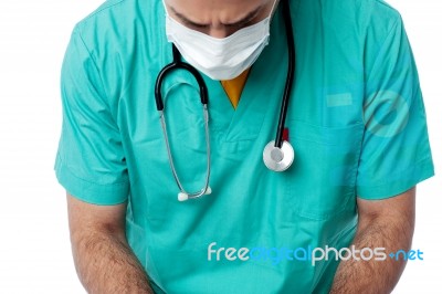 Young Male Physician Wearing Surgical Mask Stock Photo