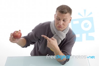 Young Male Pointing The Apple Stock Photo