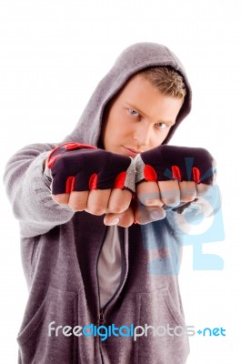 Young Male Showing Fists Stock Photo