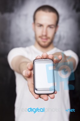 Young Male Showing Smartphone Stock Photo