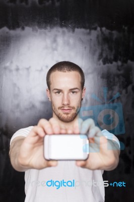 Young Male Showing Smartphone Stock Photo