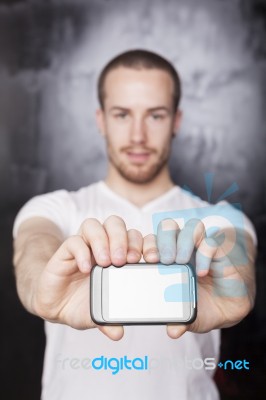 Young Male Showing Smartphone Stock Photo