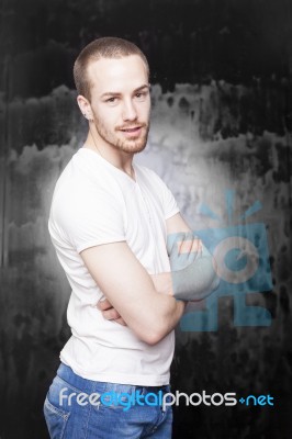 Young Male With Crossed Arms Stock Photo