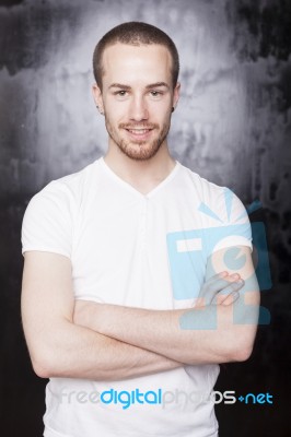 Young Male With Crossed Arms Stock Photo