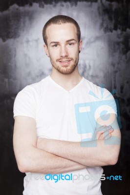 Young Male With Crossed Arms Stock Photo