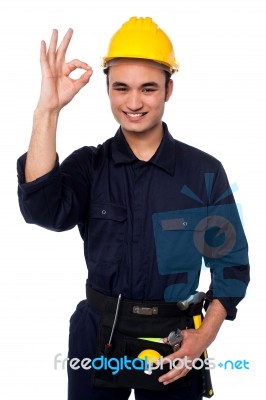 Young Male Worker Giving The Ok Sign Stock Photo