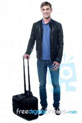 Young Man All Set To Fly For His Vacations Stock Photo