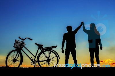 Young Man And Girl With The Silhouettes Stock Photo