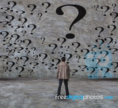 Young Man And Question Stock Photo