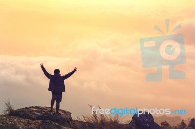 Young Man  Asia Tourist  At Mountain Is Watching Over The Misty Stock Photo