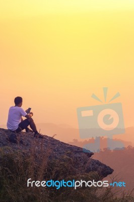 Young Man  Asia Tourist  At Mountain Is Watching Over The Misty Stock Photo