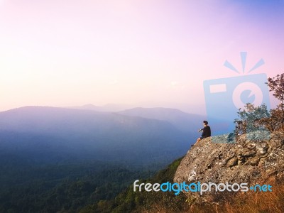 Young Man  Asia Tourist  At Mountain Is Watching Over The Misty Stock Photo